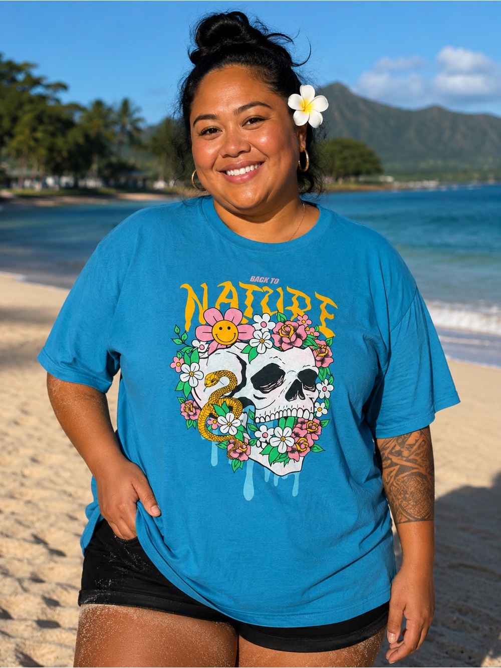 Turquoise Graphic Tee with Floral Skull Print